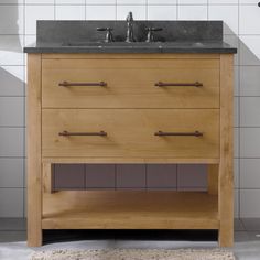 a bathroom vanity with two sinks and a rug on the floor