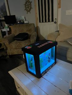 a small tv sitting on top of a wooden table