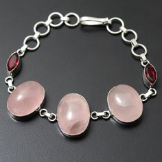 Rose Quartz Garnet Quartz Gemstone Bracelet Jewelry Gift for girl Bracelet gift For Her Sterling Silver Plated Jewelry Beautiful Bracelet Jewelry Materials Sterling Silver Plated Bracelet Size 8.4 x 0.8 Stone Name Rose Quartz Garnet Quartz Stone Color Pink, red Shipping Policy We do ship through DHL, UPS, INDIA POST. I make the gemstones myself for my valued customers so I assure you that the gemstones are Natural and are made from ethically sourced roughs. The rest of the Bracelet is made from Silver Gemstone Bracelets For Mother's Day, Mother's Day Gemstone Bracelet, Pink Crystal Gemstone Bracelet As Gift, Pink Crystal Gemstone Bracelet For Gift, Silver Rose Quartz Bracelets As Gift, Silver Rose Quartz Bracelets For Gifts, Silver Rose Quartz Bracelet For Gift, Rose Quartz Round Crystal Bracelet Gift, Crystal Bracelet With Stones As A Gift