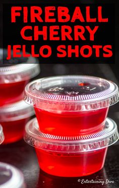 three plastic cups filled with red jello shots and the words fireball cherry jello shots