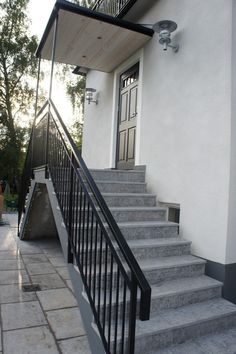 there is a stair case on the outside of this house