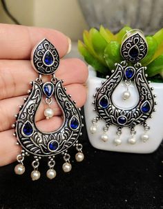 "Add charm and charisma to your beautiful personality with these exquisitely designed and handcrafted stone studded earrings in high quality German Silver. Pair them up with any semi or casual attire and win compliments for your unique choice! Weight 16 gms Length 2.7\" Width 1\" Note: All in stock items will be shipped from New Delhi, India within 2-3 business days after receipt of payment. International orders may take anytime between 3 to 5weeks for your shipments to reach you. sometimes it r Gift Stone Work Pearl Drop Earrings, Gift Pearl Drop Earrings With Stone Work, Silver Pearl Earrings With Stone Work For Gift, Temple Jewelry Stone Work Dangle Earrings, Bohemian Stone Work Earrings For Gift, Bohemian Earrings With Stone Work For Gift, Silver Chandbali Earrings With Stone Work, Chandbali Earrings With Stone Work, Stone Work Drop Earrings For Gift