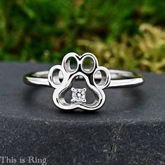 Solid 925 Sterling Silver Dainty Cute Dog Paw Open Style Clear Cubic Zirconia Prong Set Center Ring → High Polished / Rhodium Plated → 9mm Height → SOLID 925 Sterling Silver → Not Plated or Silver Filled → Minimalist Design The ring comes with a gift box as shown in the product description picture, Ready for gifting. Silver Jewelry With Paw Print For Anniversary, Silver Paw Print Jewelry For Anniversary, Silver Anniversary Jewelry With Paw Print, Adjustable Paw Print Jewelry For Anniversary, Sterling Silver Jewelry With Paw Print, Silver Jewelry With Paw Print For Personalized Gift, Adjustable Sterling Silver Jewelry With Paw Print, Adjustable Silver Jewelry With Paw Print, Elegant Sterling Silver Necklace With Paw Print