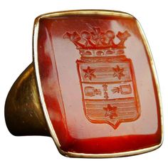 Great Nobility Intaglio Signet Ring for Men with remarkable Coats of Arms hand - engraved into the deep of hard Red banded Onyx Stone. This is a Coat of Arms of Swedish noble family of Heijkenskjöld. Very well done intaglio carving work with a lot of delicate and extremely miniature details that makes fine impression on any soft and pliable matter. Swedish hallmarks,18K, maker's hallmarks, year combo is R8 = made in 1943. Red Onyx stone with convex cut and concave cut ornament, polished to gloss Signet Ring For Men, Relief Carving, Coats Of Arms, Old Rings, Photo Equipment, Coat Of Arm, Ring For Men, Old Jewelry, Onyx Stone