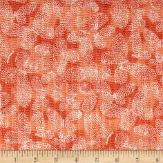 an orange and white fabric with small circles on the side, as well as a ruler