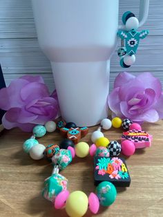 there is a vase and some beads on the table