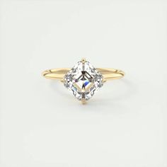 a yellow gold ring with an oval cut diamond