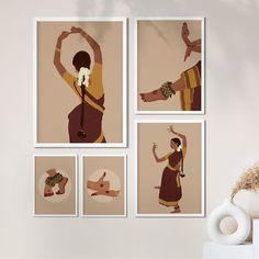 four framed art pieces on a wall above a vase