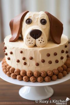 a cake with a dog's head on top is decorated in white frosting