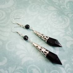 "These Victorian gothic style black or purple droplet earrings will add a touch of gothic glamour to your outfit, or just a touch of elegance if you're not a fan of the gothic look! They are made with pointed acrylic droplets encase in silverplated filigree wraps and then hung below glass beads on silverplated fittings. You can choose from earwires for pierced ears or clip ons for unpierced and they will be perfect for party season! In total they hang approx 3\" but are very lightweight and comf Black Edgy Dangle Earrings, Edgy Black Dangle Earrings, Nickel-free Black Punk Earrings, Black Nickel-free Punk Earrings, Black Edgy Sterling Silver Earrings, Edgy Black Sterling Silver Earrings, Black Sterling Silver Edgy Earrings, Gothic Drop Earrings For Formal Occasions, Gothic Black Drop Earrings