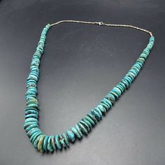 ". VINTAGE NAVAJO TURQUOISE NECKLACE DESCRIPTION: This strand features hand rolled graduated disc beads of Morenci turquoise, spaced and finished with fine hand rolled shell heishi. This gorgeous necklace will be a valuable addition to your collection of fine vintage Native American jewelry. MEASUREMENTS: Necklace measures 30\" end to end Beads measure from 9mm to 22mm across Beads are securely strung on natural fiber WEIGHT: 116.0 grams SIGNED: no" Cheap Vintage Turquoise Beaded Necklaces, Cheap Vintage Turquoise Beaded Necklace, Vintage Turquoise Necklace With Round Gemstone Beads, Vintage Turquoise Single Strand Beaded Necklace, Vintage Turquoise Single Strand Necklace, Morenci Turquoise, Necklace Shell, Vintage Native American Jewelry, Southwest Jewelry