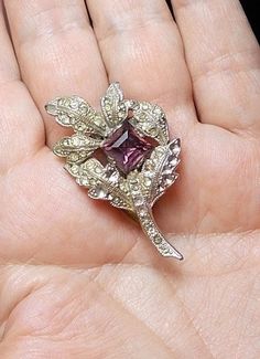 "1920 Sparkling Rhinestone Figural Flower Dress Clip Pot Metal Mirrored Purple Faceted Rhinestone Missing Several Unseen (14 of 60) Rhinestones AS IS Sparkling Brooch dress clip 1 3/4\" x 7/8\" x 3/8\". Here is a listing for 16 ways to wear a dress clip, including slip a necklace under this tight clip or as a brooch on side of lapel or blazer, or clip on your back Jeans pocket: http://www.costumejewelrycollectors.com/2013/06/15/sixteen-ways-to-wear-a-dress-clips/ Other items in final 7 pictures, Ways To Wear A Dress, Back Jeans, Diamond Symbol, Jeans Pocket, Brooch Dress, Dress Clips, Jean Pockets, Dress Clip, Metal Mirror