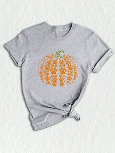 Welcome to our cozy corner of autumn! Embrace the crisp air and pumpkin spice lattes with our adorable Paw Pumpkin Shirt. This Dog Halloween Shirt is the perfect mix of spooky and cute, featuring a delightful retro pumpkin design that will have tails wagging in delight.  With a vibrant orange hue, this shirt captures the essence of the pumpkin season and brings the autumn vibes to life.  Made with love and attention to detail, this Thanksgiving gift is a must-have for any dog lover. Whether you' Paw Pumpkin, Retro Pumpkin, Plant Texture, Cute Fall Shirt, Halloween Letters, Women Crew Socks, Family Thanksgiving, Crisp Air, Pumpkin Season