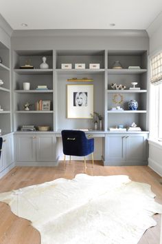 an instagram photo of a home office with built - in shelving