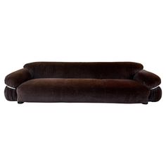 a brown couch sitting on top of a white floor