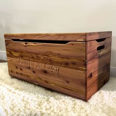 a wooden box sitting on top of a white rug