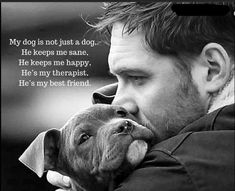 a man holding a dog in his arms with a quote on the side that says, my dog is not just a dog he keeps me sane he keeps me happy he's my