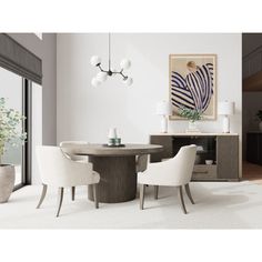 a dining room table with white chairs and an art piece on the wall behind it