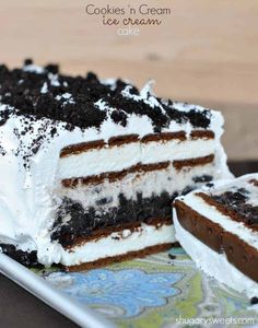 an image of a piece of cake on a plate with chocolate and white frosting