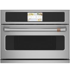 a stainless steel oven with the door open and an ad on it's side