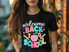 Celebrate the start of a new school year with our vibrant "Welcome Back to School" T-shirt! This fun and colorful design is perfect for teachers or anyone excited about heading back to the classroom. The cheerful lettering brings a touch of joy and positivity to any back-to-school outfit. Key Features: High-quality Roland heat soft premium vinyl that has screen print feel Design size varies depending on the size of the shirt Available in black and grey t-shirt colors Comfortable and durable fabr Cheap Back To School T-shirt, Cheap T-shirt For Back To School, Affordable Back To School T-shirt With Text Print, Cheap Back To School T-shirt With Text Print, Cheap Text Print T-shirt For Back To School, School Apparel, Teacher Gift Back To School, Colorful Lettering, Back To School Gifts For Teachers