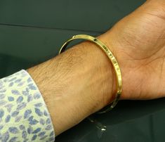 "Solid silver handmade Punjabi style kada bangle bracelet for boy's and girl's, best gifting unisex jewelry from India. Metal- solid silver. Item type- Bangle kada. Weight- grams. Width-6 mm approx. size-2-14 or 2.8\" or 73cm(31.660 grams) Finish-Gold polished over pure silver." Yellow Gold Cuff Bracelet With Shiny Finish As Gift, Adjustable Shiny Bangle, Yellow Gold Cuff Bracelet With Shiny Finish, Round Gold Bracelet With Shiny Finish For Gift, Round Gold Bracelet With Shiny Finish As Gift, Round Hand Set Cuff Bracelet Gift, Ceremonial Round Bangle With Polished Finish, Yellow Gold Cuff Bracelet For Festivals, Hand Set Round Cuff Bracelet As Gift