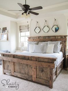 a bedroom with a bed and ceiling fan on the wall above it is featured in an instagram