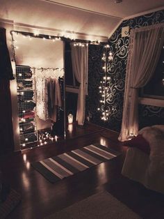 a bedroom decorated with lights and curtains