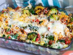 a casserole dish with broccoli, pasta and cheese