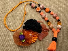 Black and orange necklace and hair clip for children. Fall kids gift. Orange and black organza flower for hair and matching necklace. Kids.  Gift for children in Autumn season. Necklace with glass and acrylic beads. Slipknot to fit most sizes.   Hair clip with organza flowers and fancy feathers Thank you for visiting our store, follow us on social networks to stay updated on specials and events. If you wish you can send me an email, it will be a pleasure to answer you www.facebook.com/brisasboutique2013 www.instagram.com/brisasboutique2013 Fall Necklaces For Kids, Flower For Hair, Orange Necklace, Organza Flowers, Black And Orange, Fall Kids, Lovely Necklace, Matching Necklaces, Seasonal Fashion