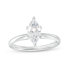 a white gold ring with an oval cut diamond