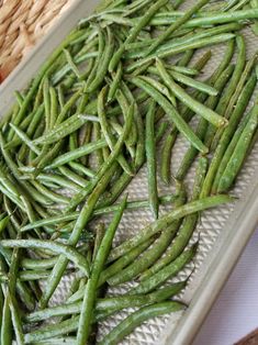 some green beans are sitting on a tray