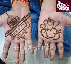 two hands with hendi designs on them