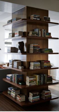 the bookshelf is filled with many different types of books on it's shelves