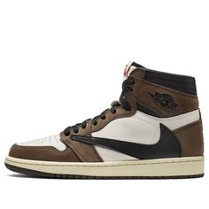 The Travis Scott x Air Jordan 1 features Red Nike and Cactus Jack tongue labels. But the most notable feature is the logo "Cactus Jack" on the tongue and other finishes including a secret pocket in the lining of the pair. (AJ1/SNKR/Unisex/High Top/Basketball) Brown High-top Sneakers With Logo Patch, Custom Sneakers With Logo Patch For Streetwear, Custom Streetwear Sneakers With Logo Patch, Brown Retro Custom Sneakers For Streetwear, Classic Brown Custom Sneakers For Streetwear, Modern Brown Custom Sneakers For Streetwear, Travis Scott Aj1, Air Jordan Travis Scott, Jordan Travis Scott