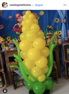 a bunch of balloons that are in the shape of a cornucre on top of a table