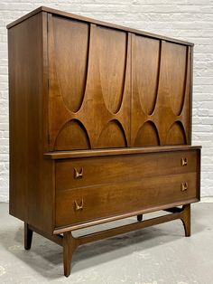 an old wooden dresser with two drawers