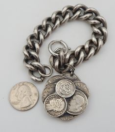 "Tantalizing vintage Napier charm bracelet. It is the kind of piece a world traveler would buy on one of their many excursions. I adore this Napier piece. It is not the \"norm\" in Napier charm bracelets. It is both simple and incredible. The single charm is designed to mimic foreign coins from Mexico and France. The detail on the coins is truly unique. The bracelet holding the charm is significant. The links are large, which helps balance the design element of the charm. Condition is good. One Napier Sterling Silver Vintage Coin Bracelate, Antique Silver Nickel-free Bracelets, Vintage Nickel-free Sterling Silver Bracelet In Antique Silver, Adjustable Vintage Jubilee Charm Bracelet, Nickel-free Antique Silver Vintage Sterling Silver Bracelet, Antique Nickel-free Bracelets, Vintage Bracelet With Lobster Clasp, Silver Vintage Bracelets With Vintage Charm, Vintage Jewelry With Jubilee Bracelet For Collectors