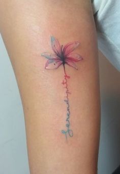 a woman's arm with a dragonfly tattoo on the back of her leg