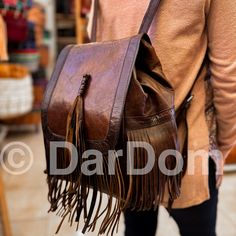 Moroccan Leather Backpack Vintage Leather Backpack Handmade Backpack Brown Backpack ## Product Characteristics ## -Dimension : (12H * 9W)inch  [30 cm H * 25 cm W ] -Color : Dark Brown -Material: 100 % Goat leather -100% Handmade - This backpack is handcrafted from high quality goat leather. The leather we use is treated with natural materials that make the leather has no unpleasant smell. This backpack is the best choice for your travels, because it is very durable and can withstand heavy weight Backpack Handmade, Brown Backpack, Handmade Backpack, Vintage Leather Backpack, Handmade Leather Backpack, Backpack Vintage, Handmade Backpacks, Brown Backpacks, Moroccan Leather