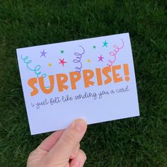 someone holding up a card that says, surprise i just felt like sending you a card