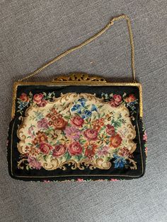 "Vintage Floral Tapestry Purse with a bright colorful floral design on a black background. Has a gold frame and sleek classic chain strap. Fully lined in beige satin with a slip pocket. Size of purse is 9\" x 7\". Classic stylish look. Slight discoloration on the edges of the satin along the gold frame." Elegant Evening Bags With Floral Print, Elegant Floral Print Evening Bags, Elegant Party Bag With Floral Print, Tapestry Purse, Pink Basket, Blue Fern, Floral Tapestry, Pocket Size, Clutch Handbag