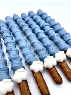 blue and white desserts are arranged in the shape of clouds