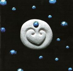 a white smiley face with blue bubbles around it on a black background, surrounded by smaller blue balls