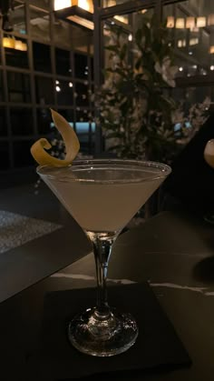 a martini glass sitting on top of a table