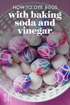 some eggs are in a white bowl with pink and blue designs on them, the words how to dye eggs with baking soda and vinegar