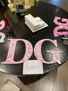 a table with letters that spell out the word dog on it, and other decorations