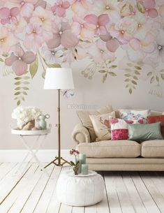 a living room with flowers painted on the wall