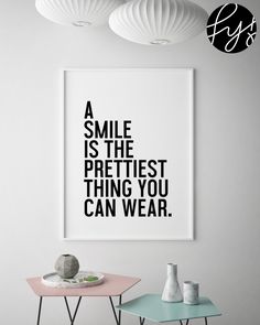 a poster with the quote a smile is the prettiest thing you can wear