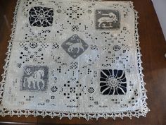 an old doily with various designs on it